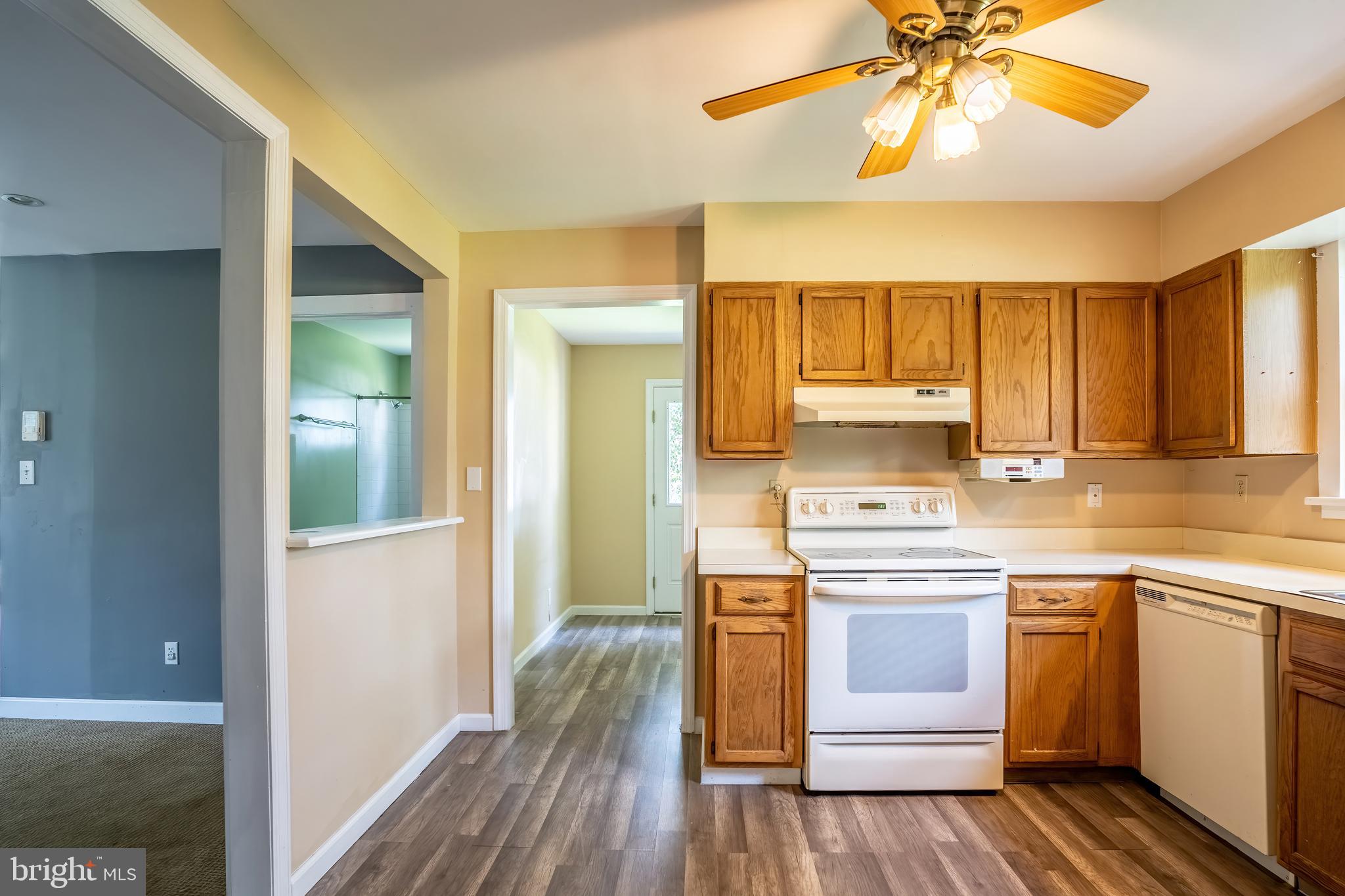 74 Woods Road Hightstown, NJ 08520 - Photo 47 of 57 a kitchen with a stove cabinets and wooden floor