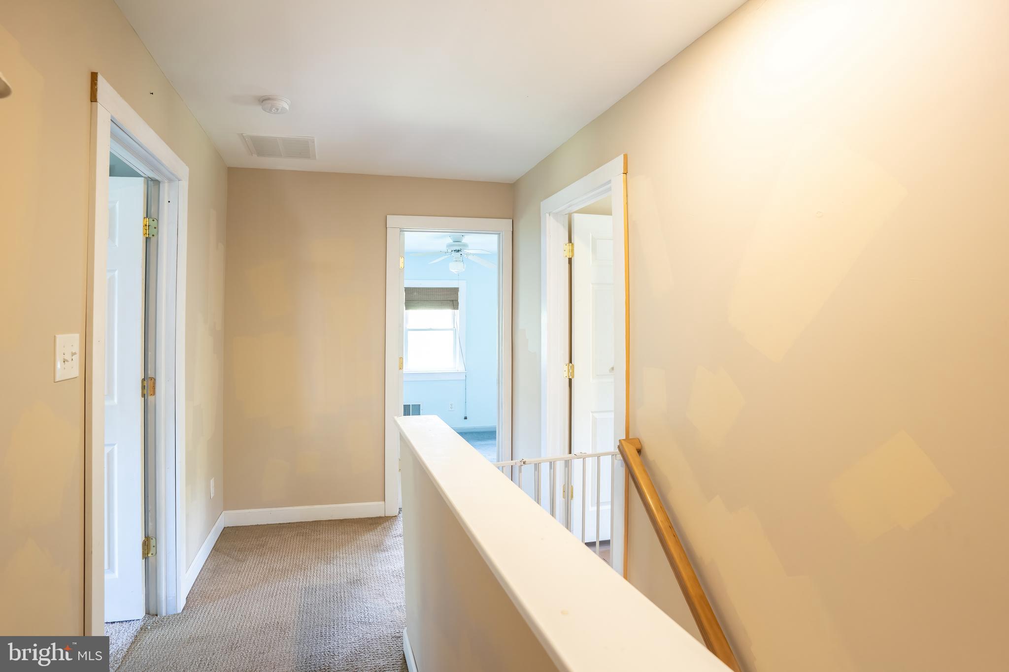 74 Woods Road Hightstown, NJ 08520 - Photo 51 of 57 a view of a hallway with wooden floor