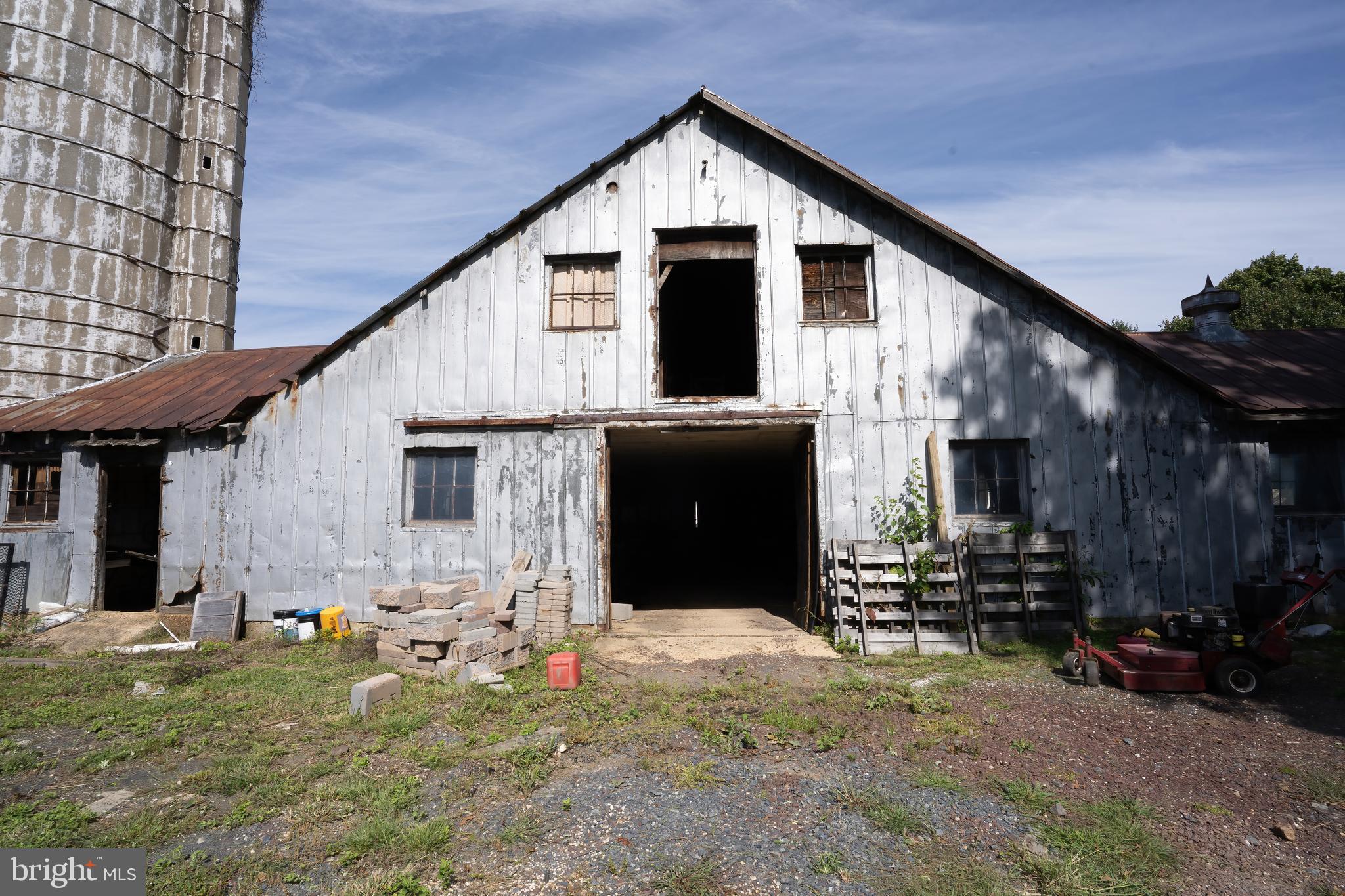 74 Woods Road Hightstown, NJ 08520 - Photo 52 of 57 a backyard of a house with barbeque oven and outdoor seating