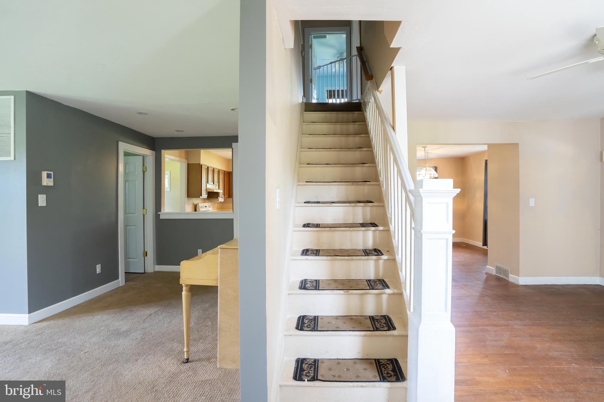 74 Woods Road Hightstown, NJ 08520 - Photo 9 of 57 a view of a living room with wooden floor and windows
