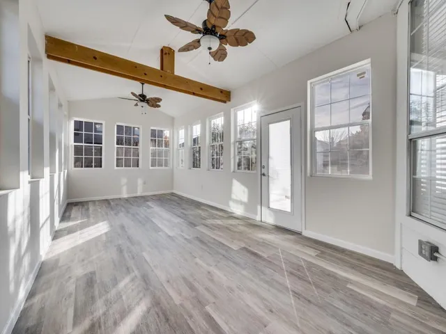 a view of an empty room with a window