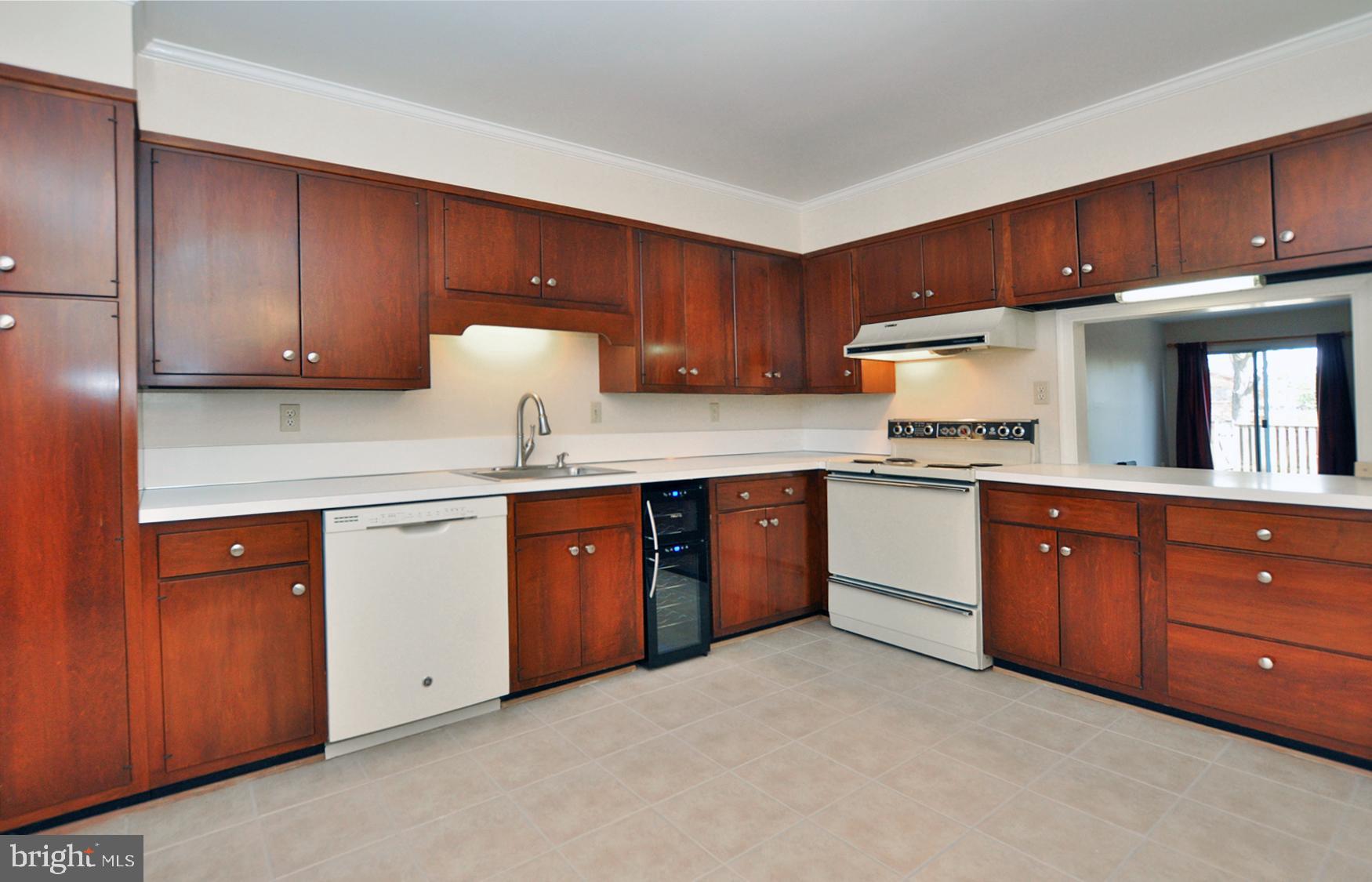 4847 Sangamore Road, Unit 24 Bethesda, MD 20816 - Photo 7 of 31 Lots of workspace; new wine fridge!