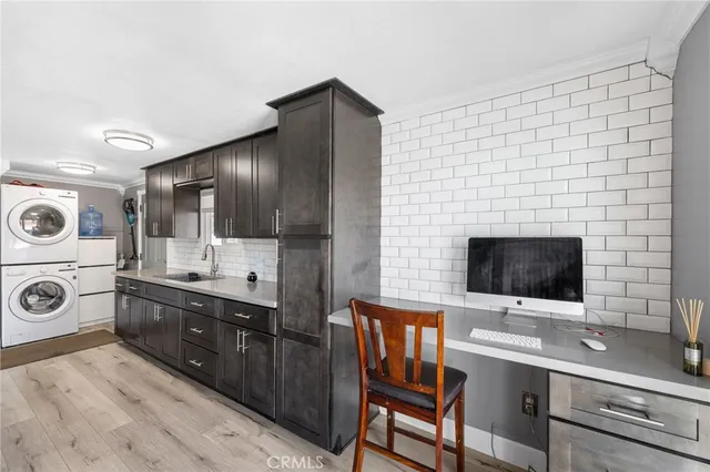 a kitchen with stainless steel appliances a stove microwave and cabinets