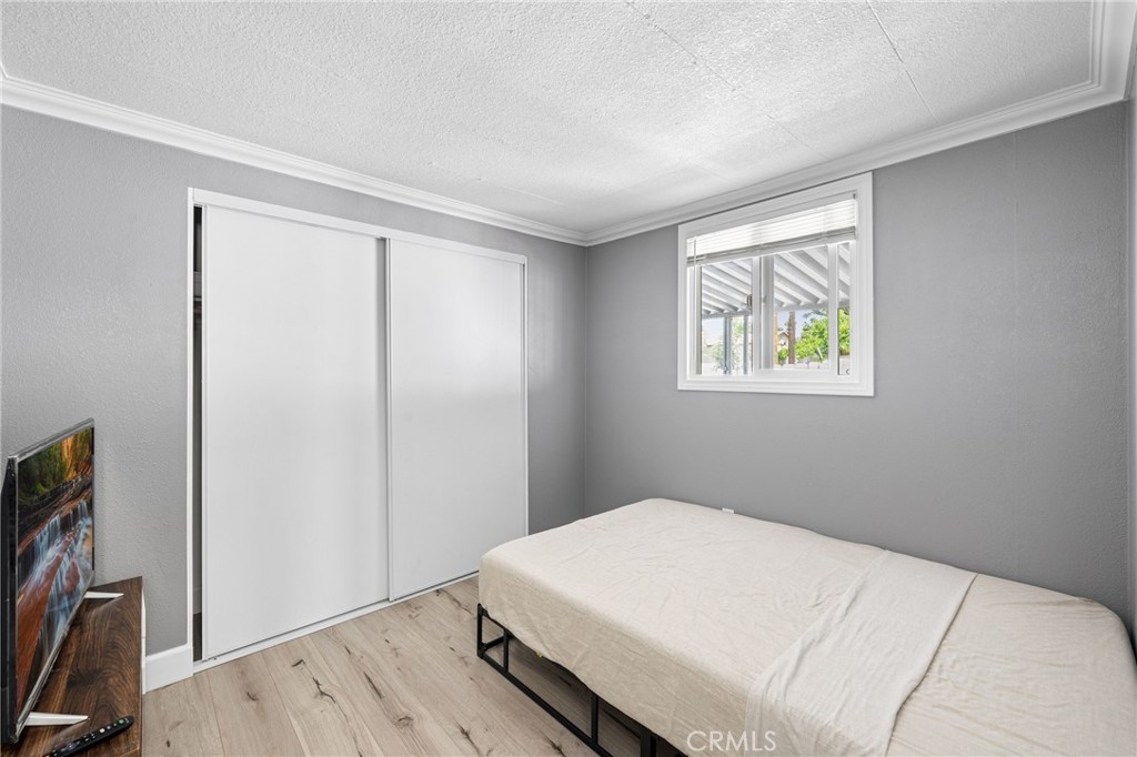 32857 Valley View Avenue Lake Elsinore, CA 92530 - Photo 8 of 12 a bedroom with a bed and a window