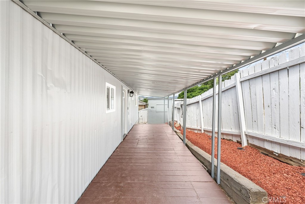 32857 Valley View Avenue Lake Elsinore, CA 92530 - Photo 10 of 12 a view of a hallway with wooden floor and staircase