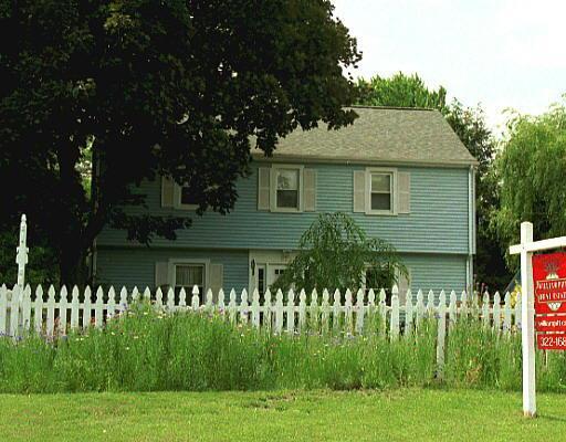 302 Sun Dance Road Stamford, CT 06905 - Photo 1 of 1 a front view of a house with a garden