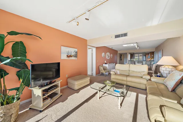 a bedroom with a large bed and a balcony view