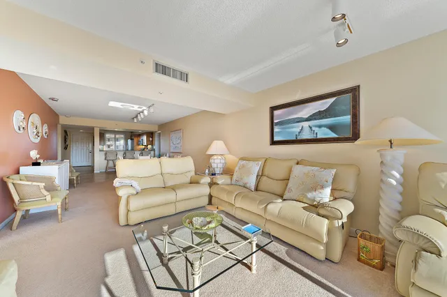 a bedroom with a large window and a bed