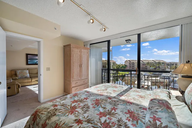a spacious bathroom with a toilet a sink and a mirror
