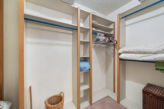 a bathroom with a granite countertop sink a toilet and shower curtain
