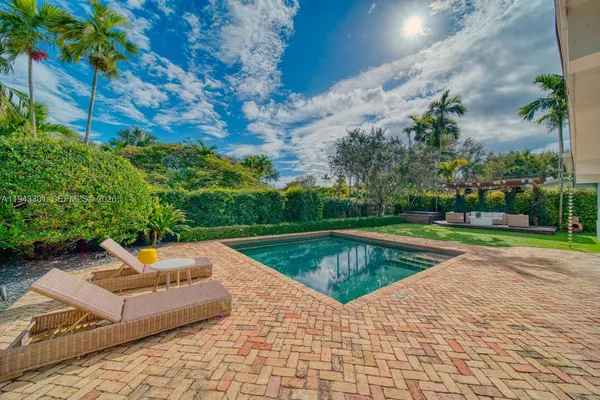 a view of swimming pool with lounge chair