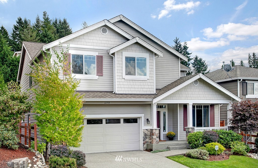 22931 36th Avenue Southeast Bothell, WA 98021 - Photo 1 of 1 a view of a white house next to a yard
