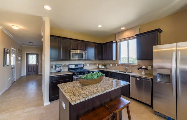 a kitchen with a stove a refrigerator and a refrigerator