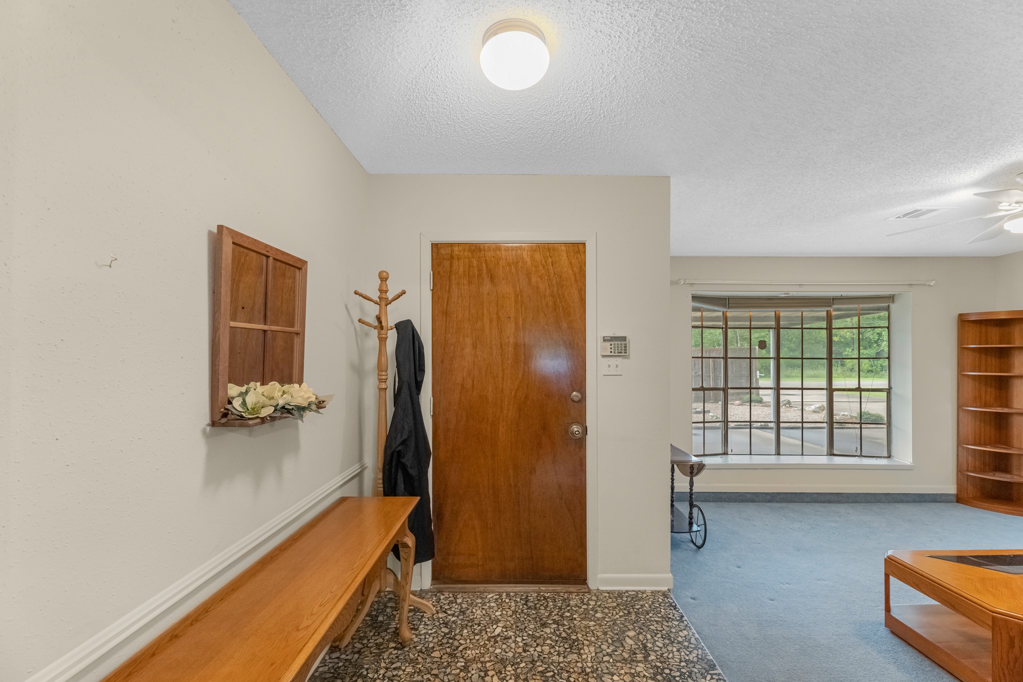 7315 Pine Street Manvel, TX 77578 - Photo 28 of 50 a hallway with a door and a couch