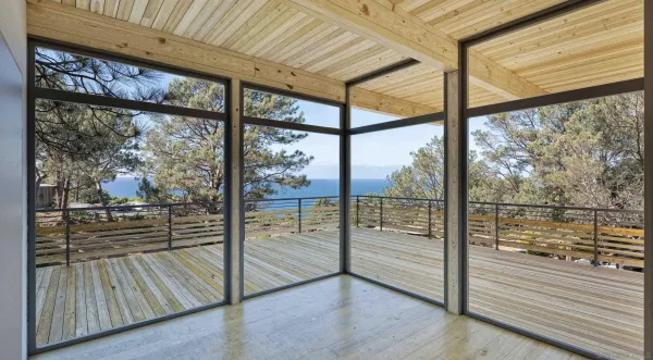 a view of a room with wooden floor