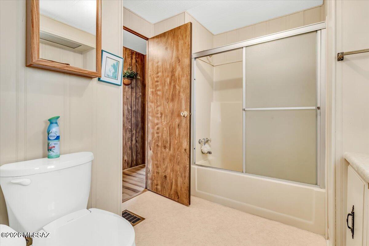 5840 West Flying W Street Tucson, AZ 85713 - Photo 25 of 38 a bathroom with a shower a toilet and a shower