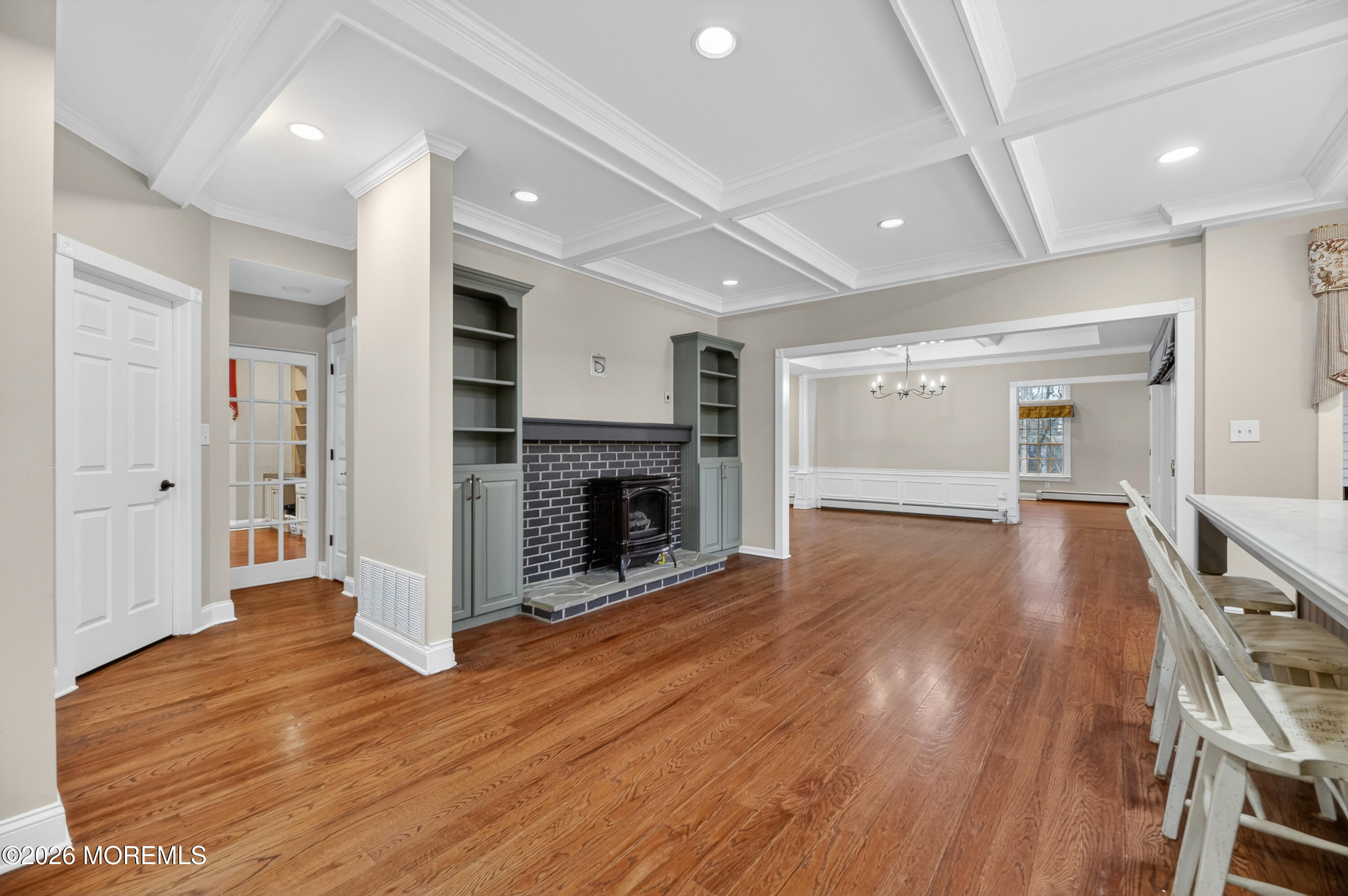 27 Carrs Tavern Road Millstone Township, NJ 08510 - Photo 14 of 78 a view of a big room with wooden floor and fireplace