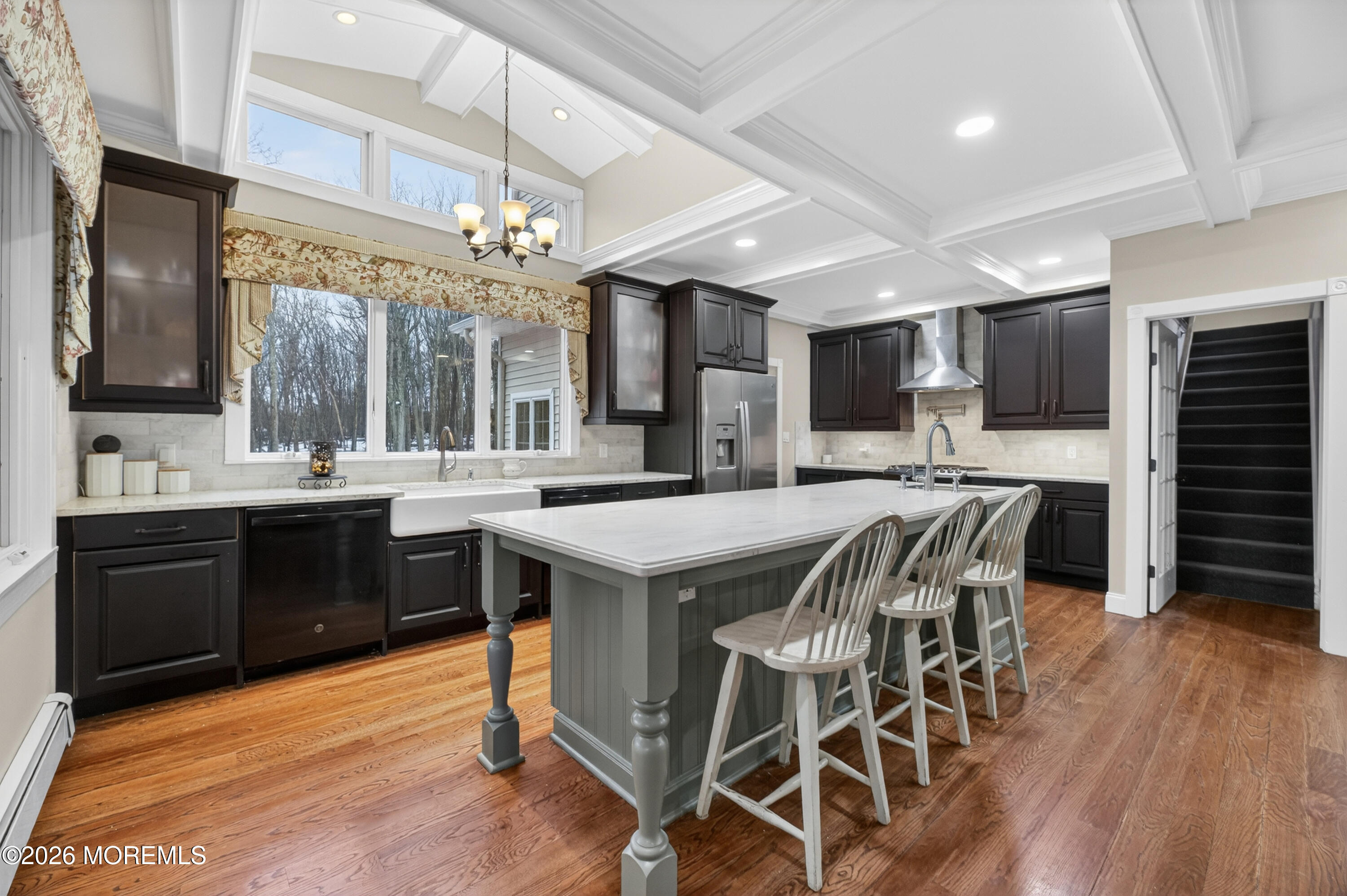 27 Carrs Tavern Road Millstone Township, NJ 08510 - Photo 18 of 78 a kitchen with stainless steel appliances granite countertop a stove a sink dishwasher a microwave oven with a dining table and chairs