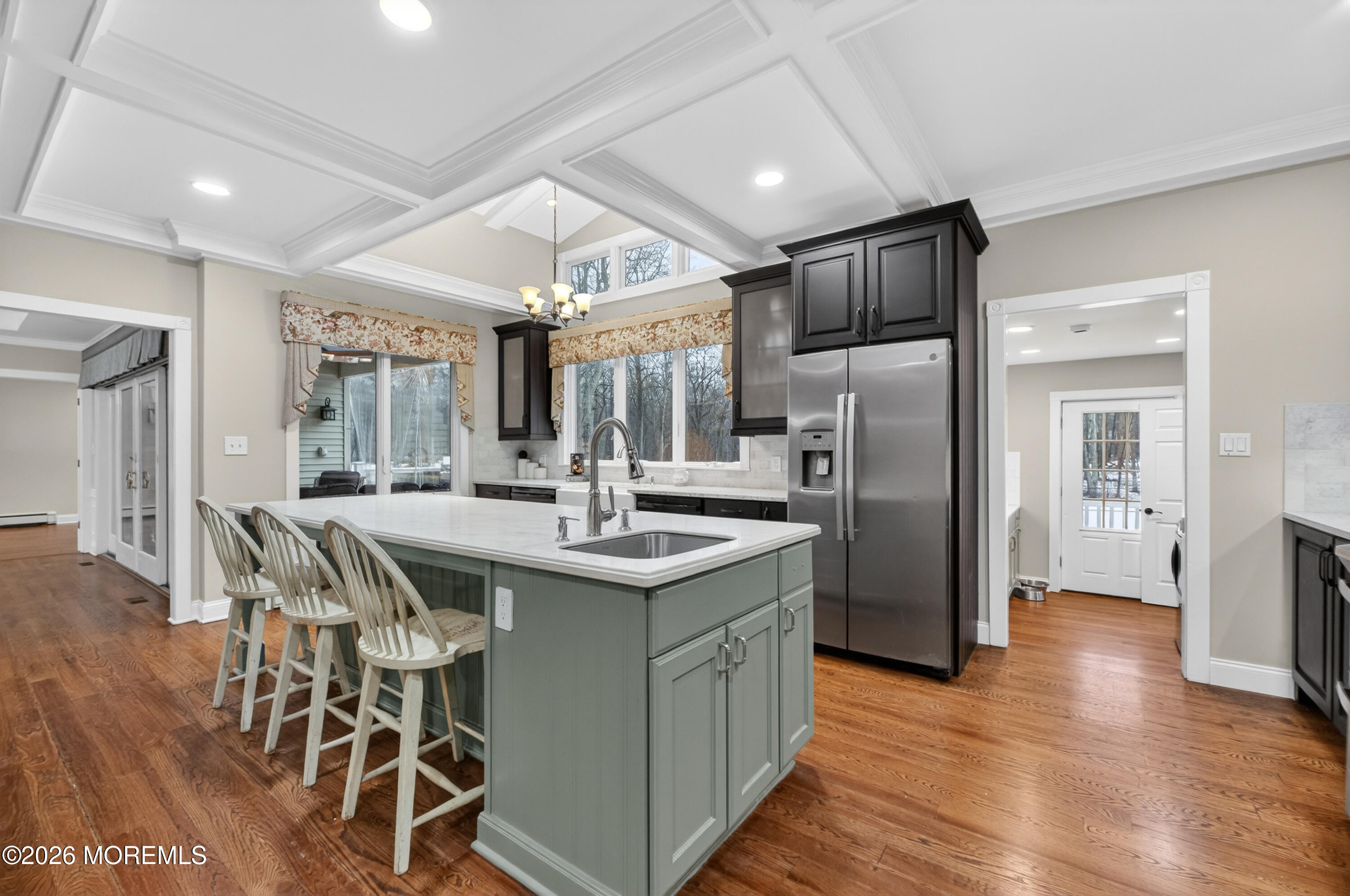 27 Carrs Tavern Road Millstone Township, NJ 08510 - Photo 19 of 78 a kitchen with stainless steel appliances granite countertop a table chairs refrigerator and sink
