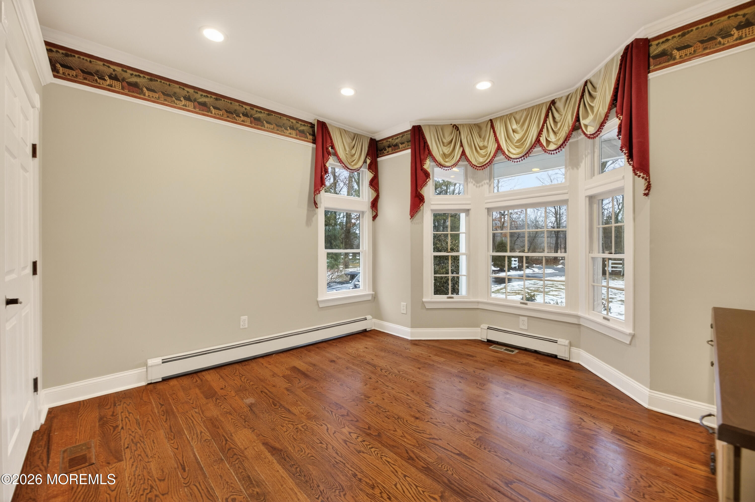 27 Carrs Tavern Road Millstone Township, NJ 08510 - Photo 25 of 78 a view of an empty room with a window and wooden floor