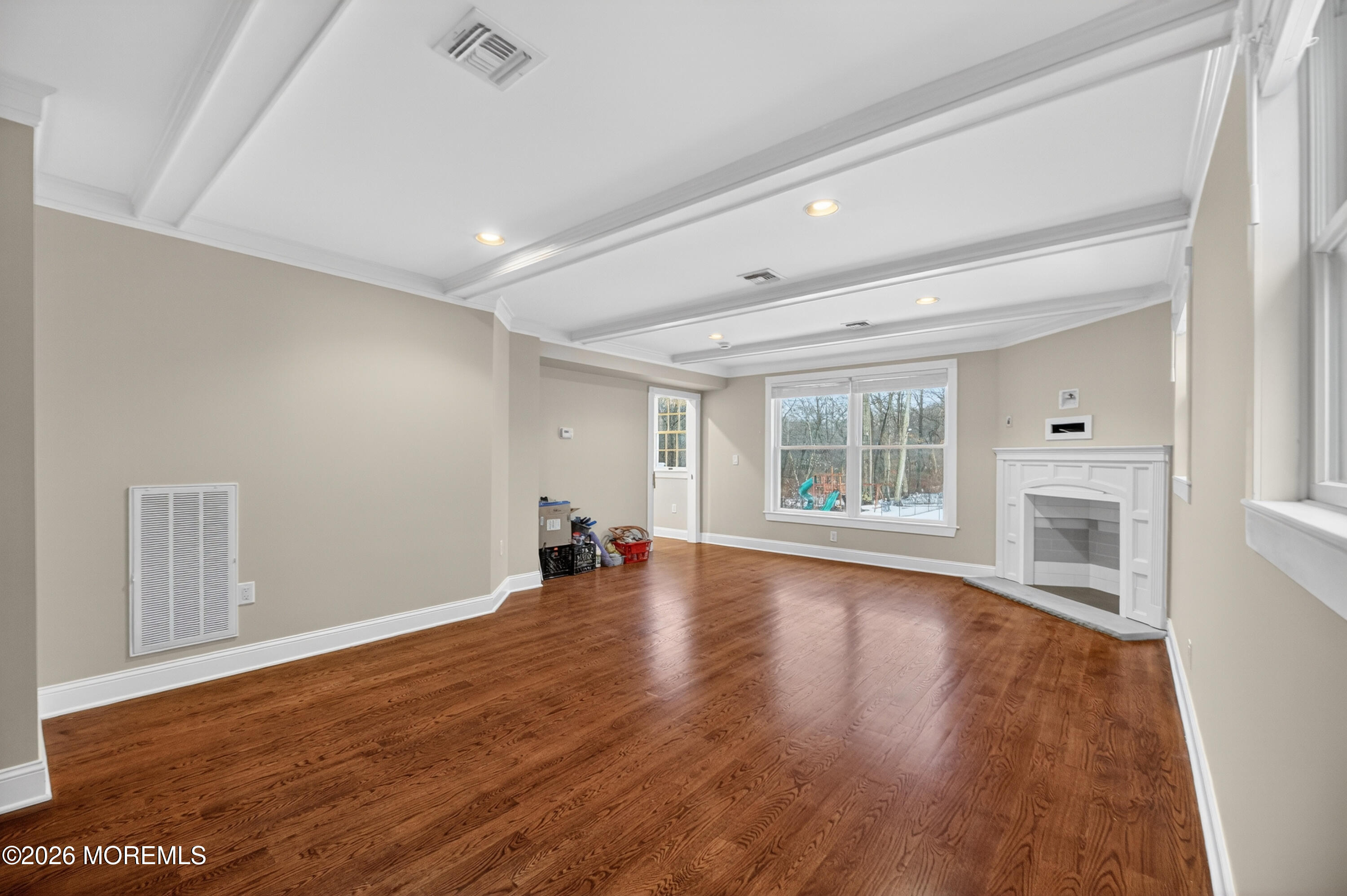 27 Carrs Tavern Road Millstone Township, NJ 08510 - Photo 35 of 78 wooden floor in an empty room with a window