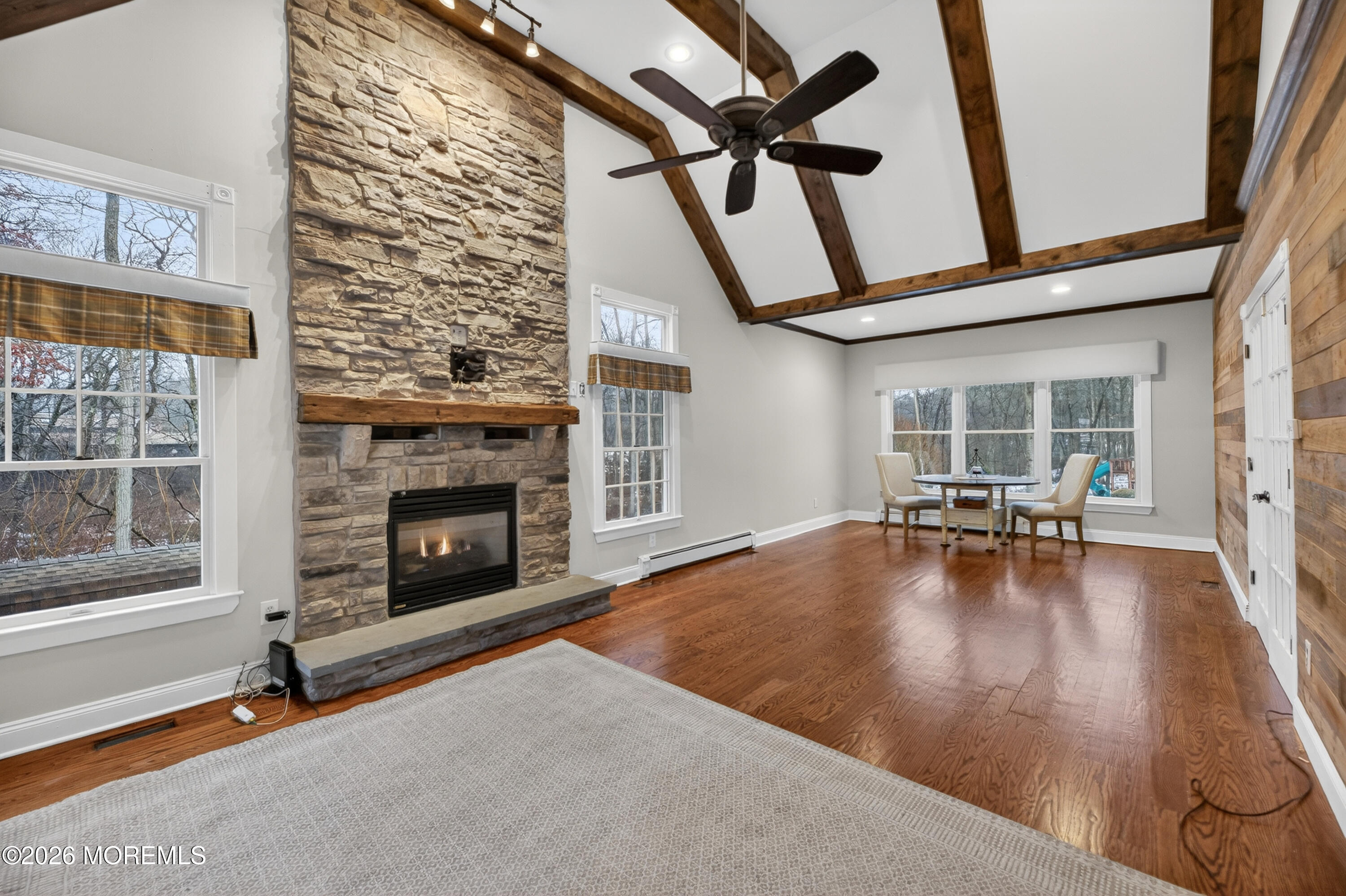 27 Carrs Tavern Road Millstone Township, NJ 08510 - Photo 41 of 78 a view of a livingroom with furniture and a fireplace