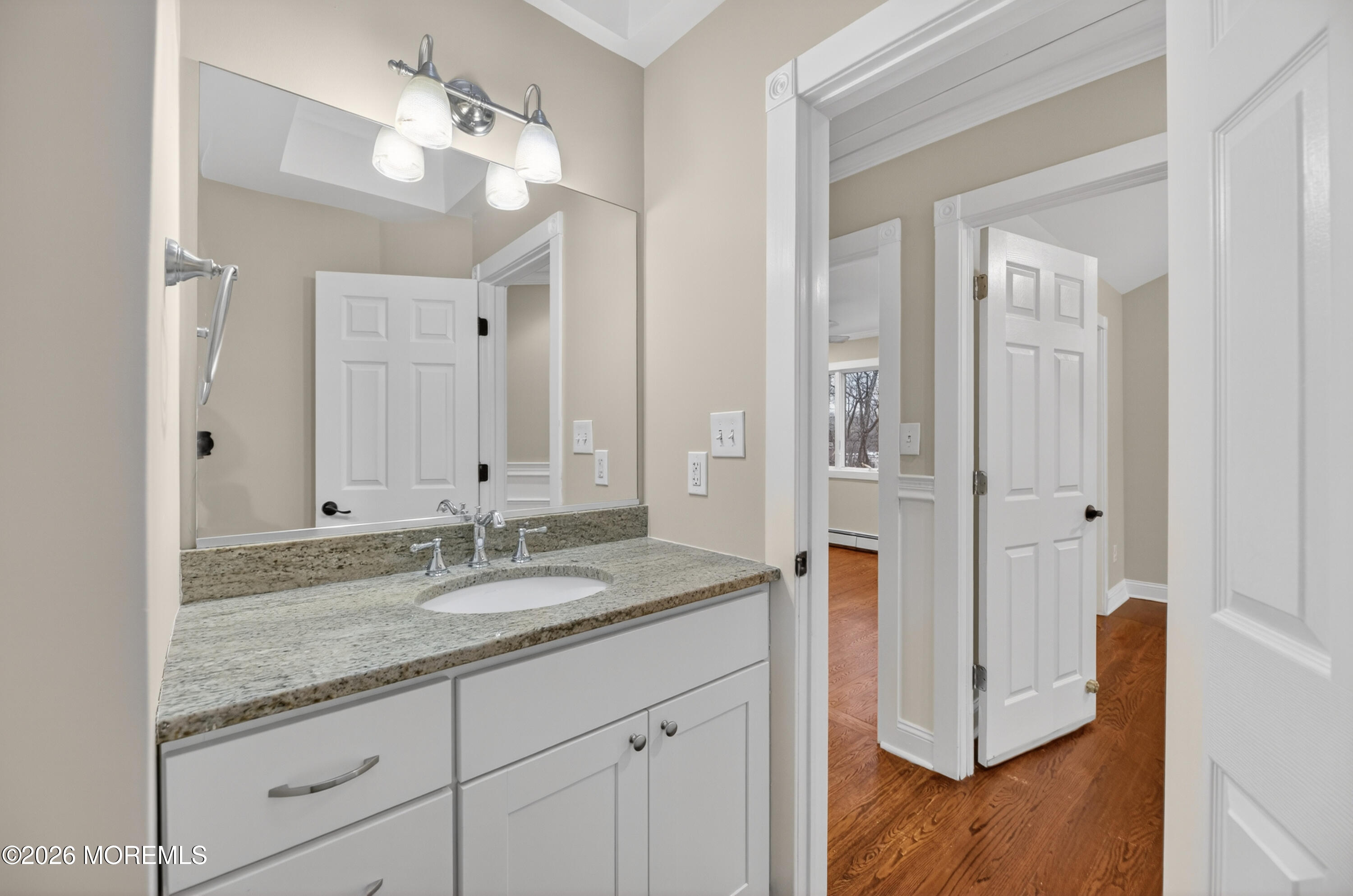 27 Carrs Tavern Road Millstone Township, NJ 08510 - Photo 48 of 78 a bathroom with a granite countertop sink and a mirror