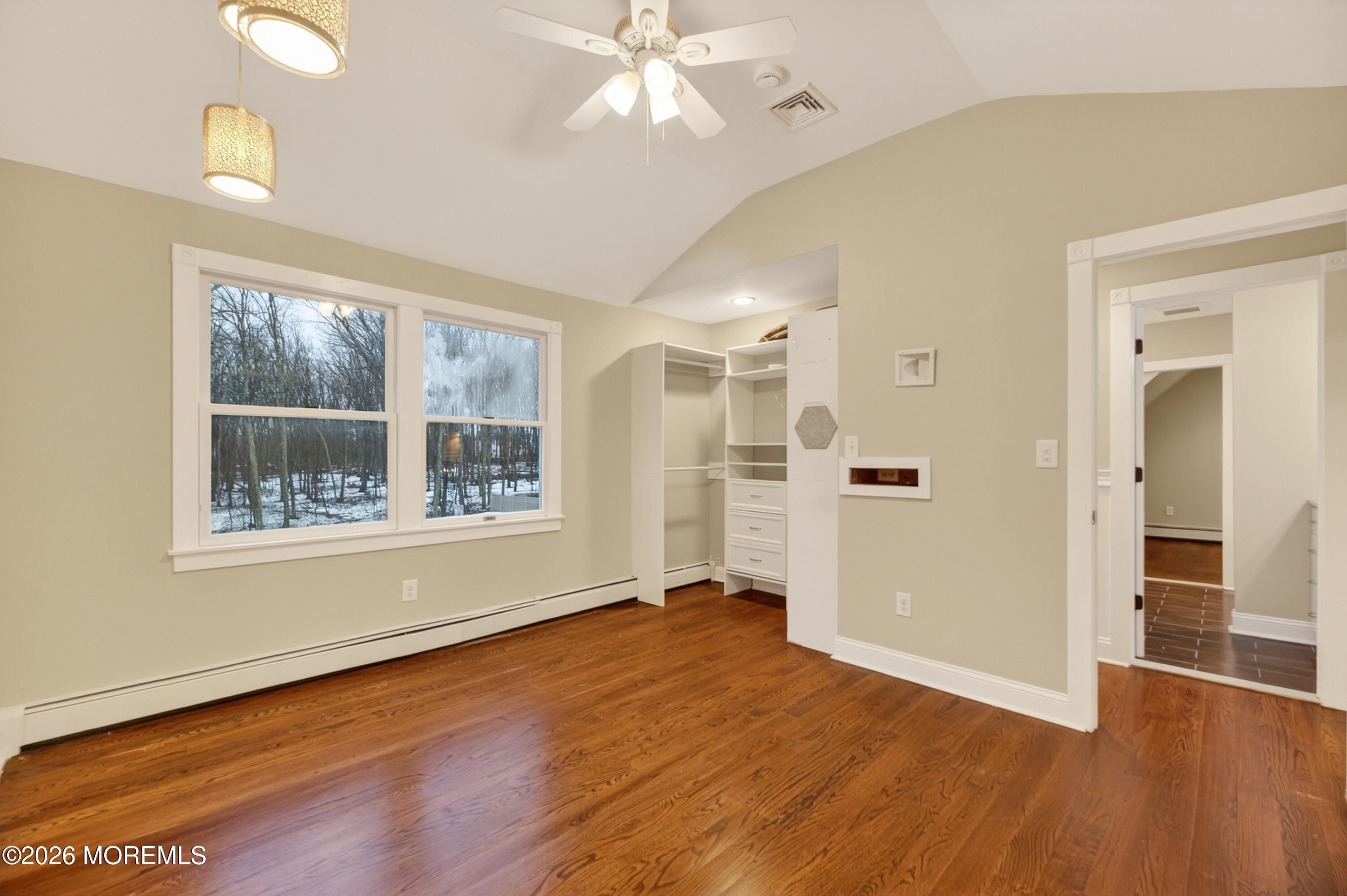 27 Carrs Tavern Road Millstone Township, NJ 08510 - Photo 50 of 78 a view of an empty room with wooden floor and a window