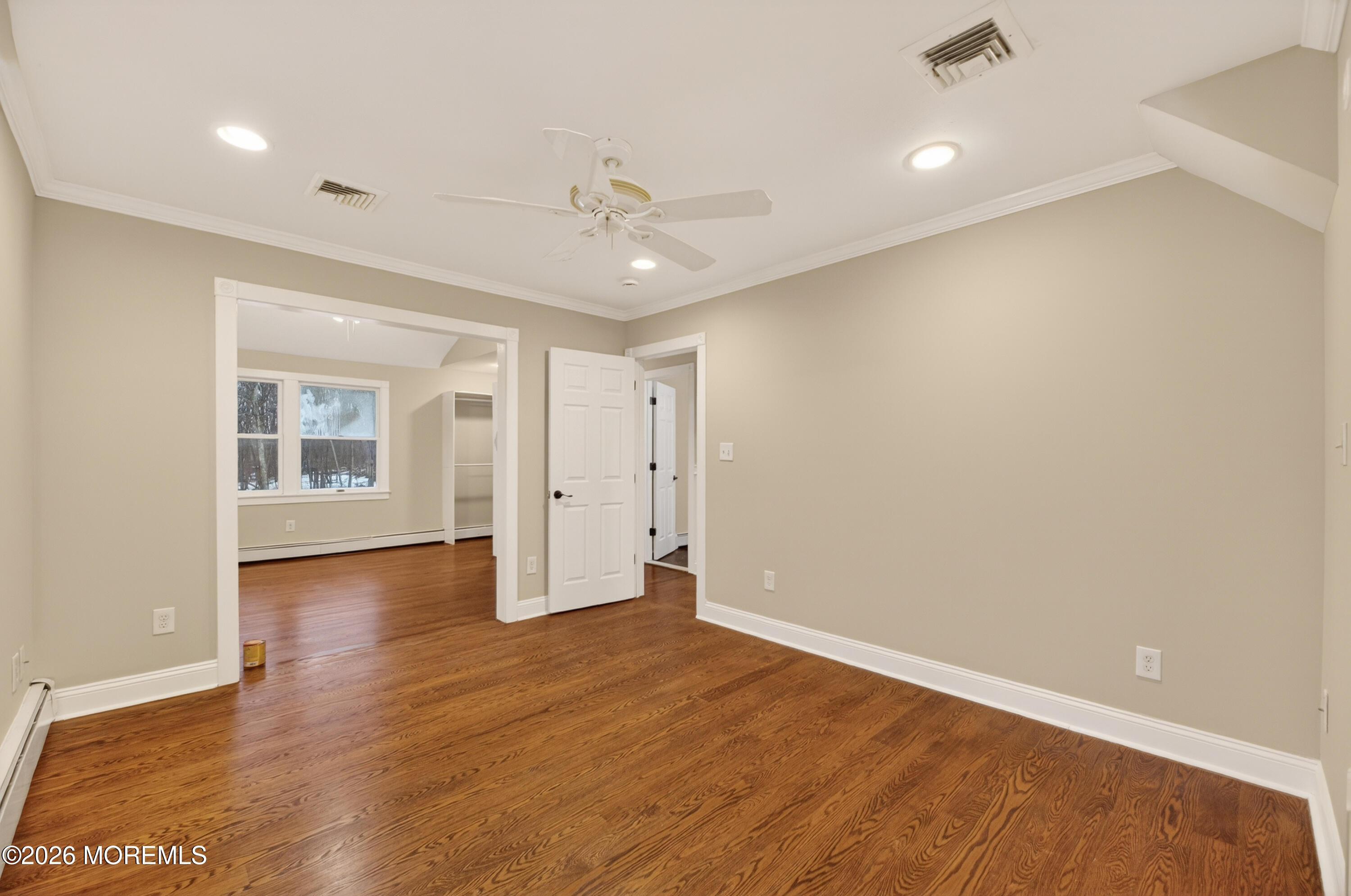 27 Carrs Tavern Road Millstone Township, NJ 08510 - Photo 51 of 78 wooden floor in an empty room with a window
