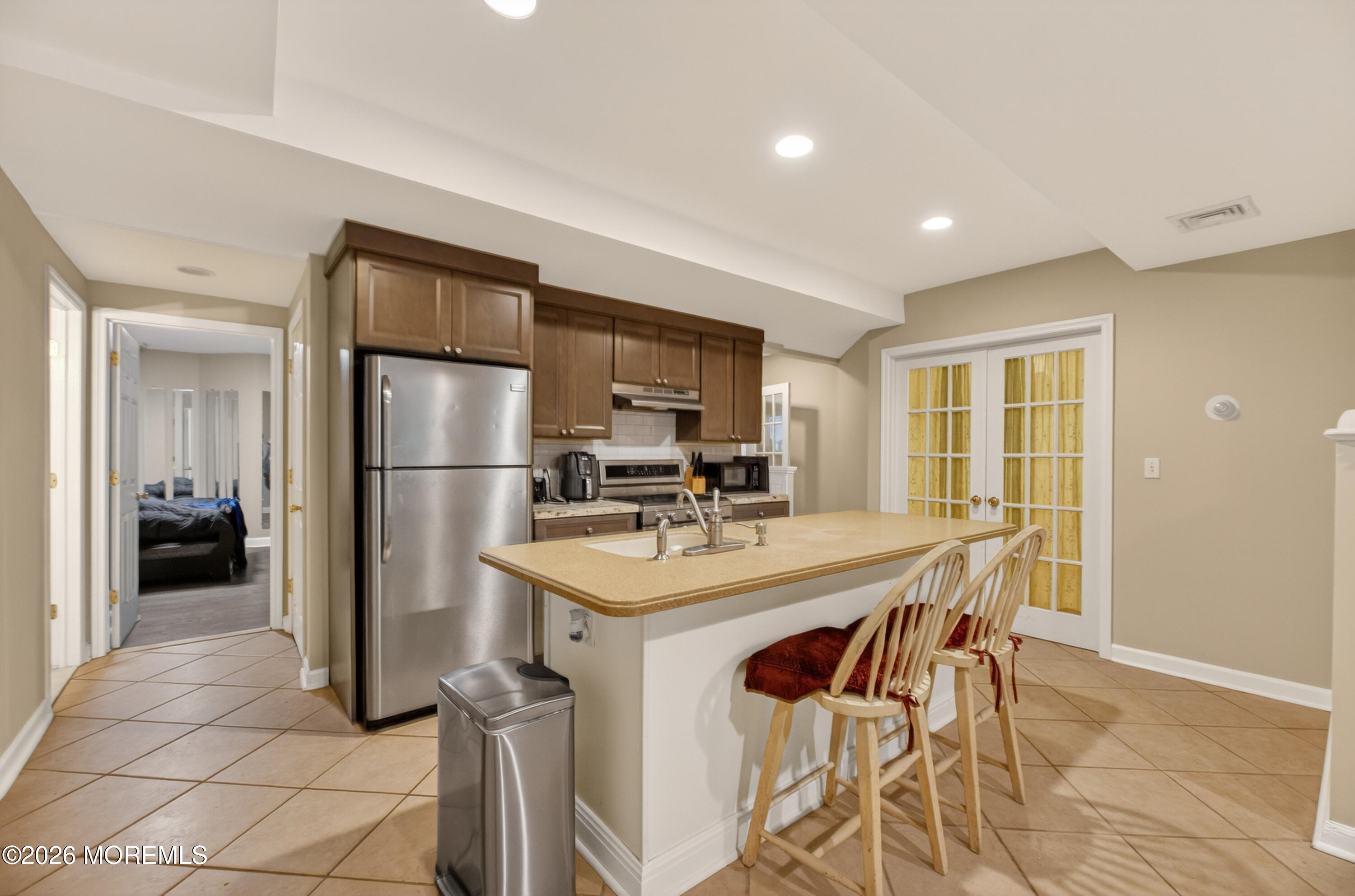 27 Carrs Tavern Road Millstone Township, NJ 08510 - Photo 55 of 78 a kitchen with stainless steel appliances granite countertop a sink a stove a refrigerator and a refrigerator
