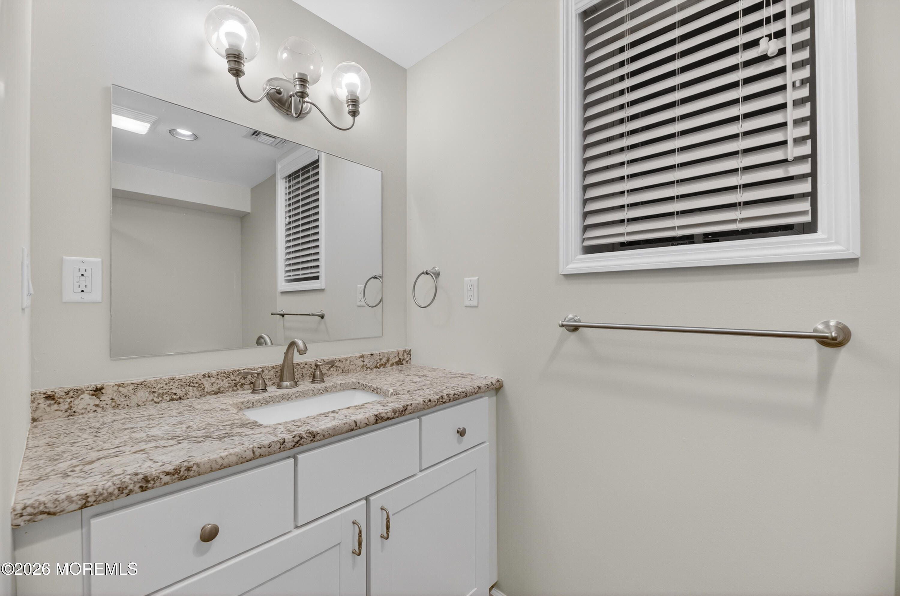 27 Carrs Tavern Road Millstone Township, NJ 08510 - Photo 61 of 78 a bathroom with a granite countertop sink a mirror and a shower