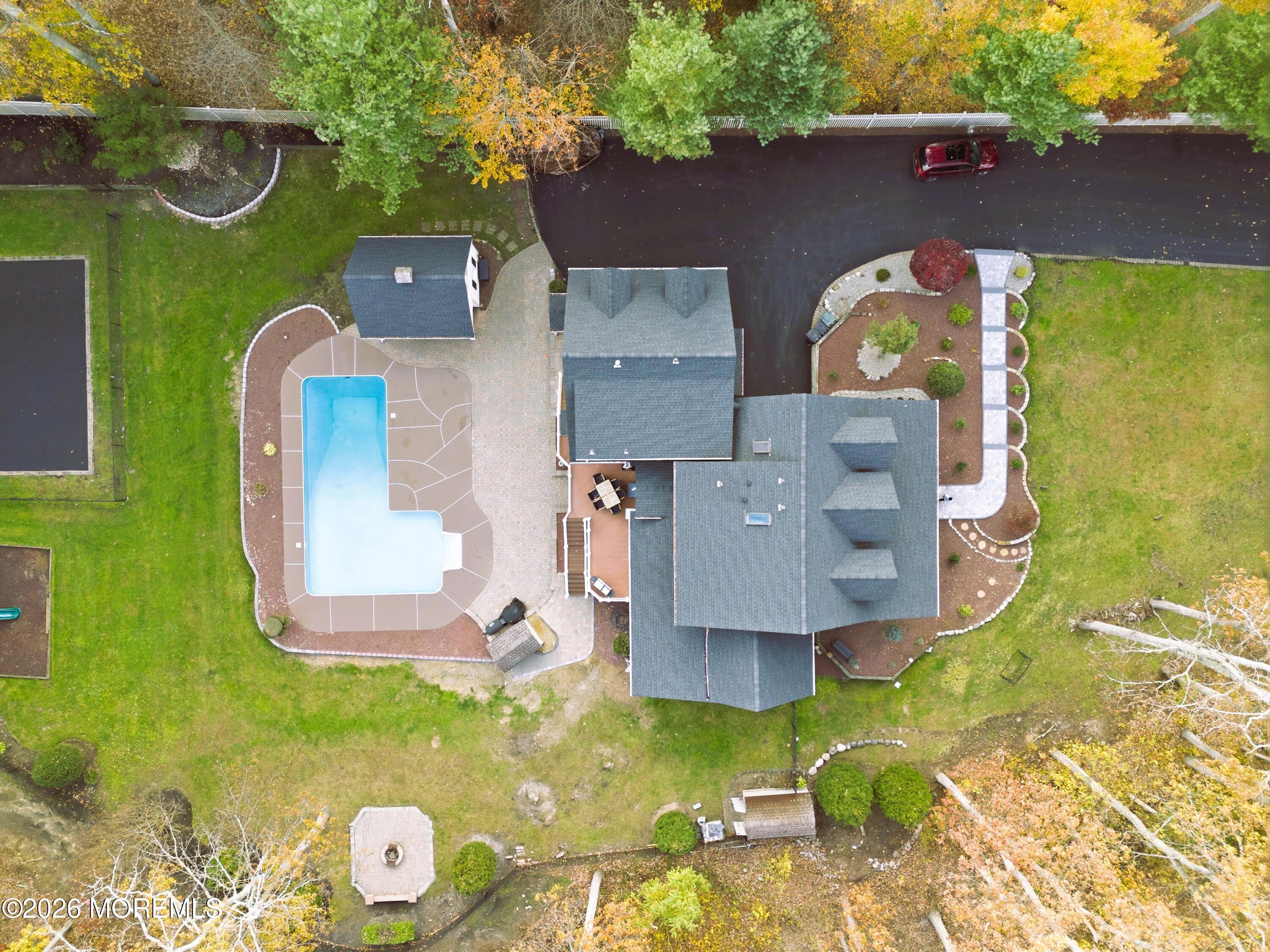 27 Carrs Tavern Road Millstone Township, NJ 08510 - Photo 67 of 78 an aerial view of a house with swimming pool