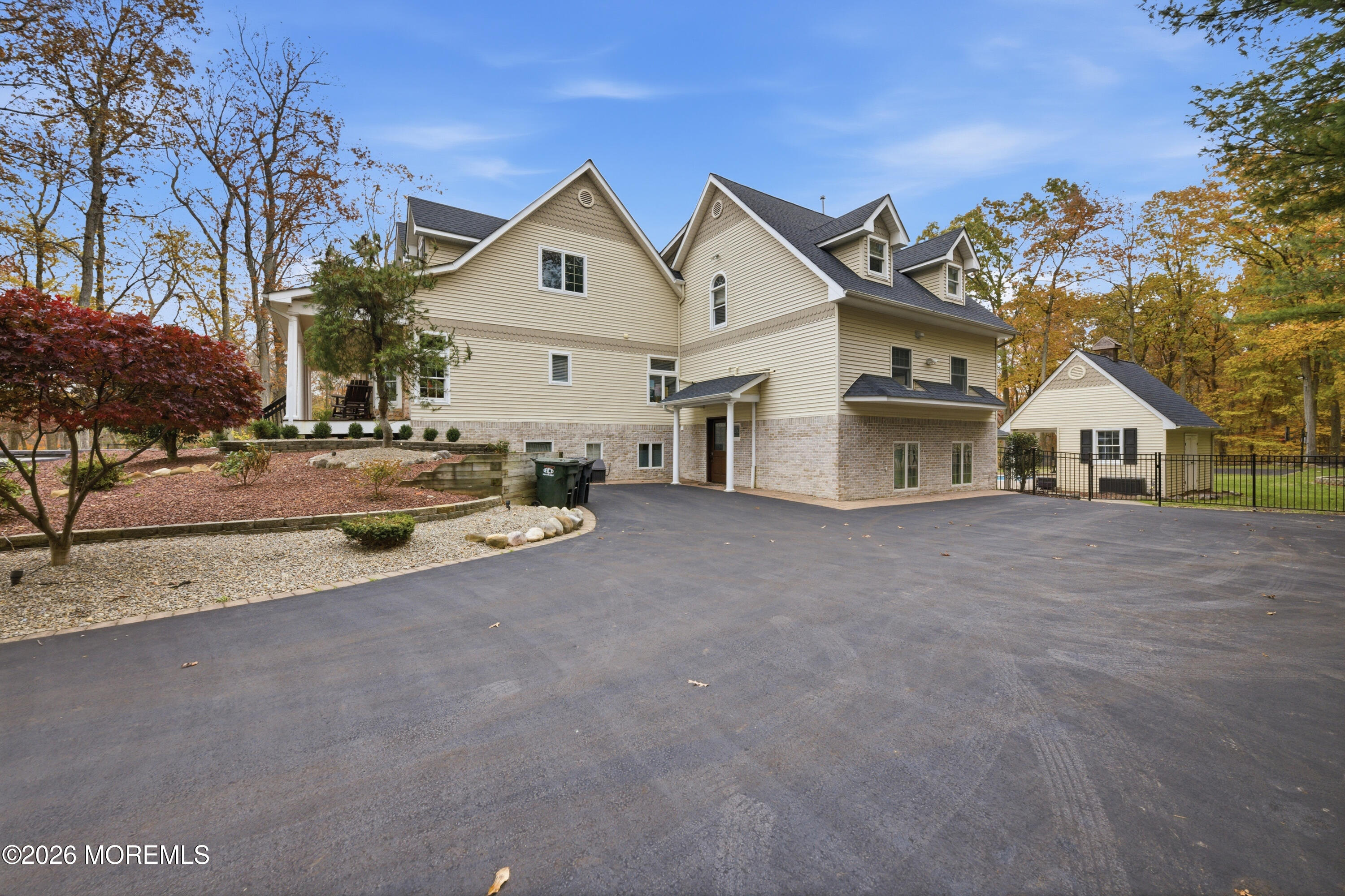 27 Carrs Tavern Road Millstone Township, NJ 08510 - Photo 70 of 78 a view of white house with a yard and potted plants
