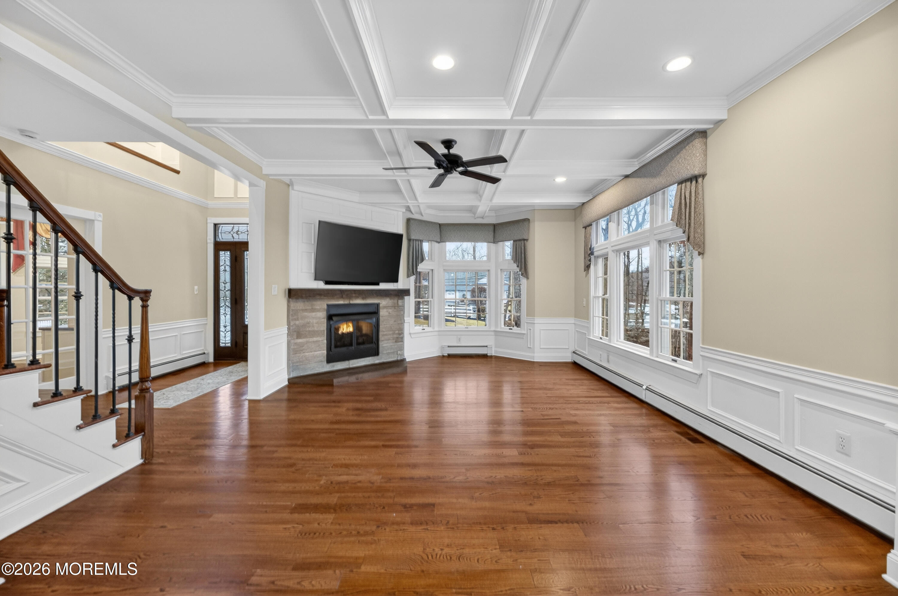27 Carrs Tavern Road Millstone Township, NJ 08510 - Photo 7 of 78 a view of a livingroom with wooden floor and a ceiling fan