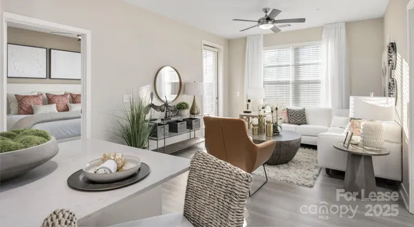 a living room with furniture and a large window