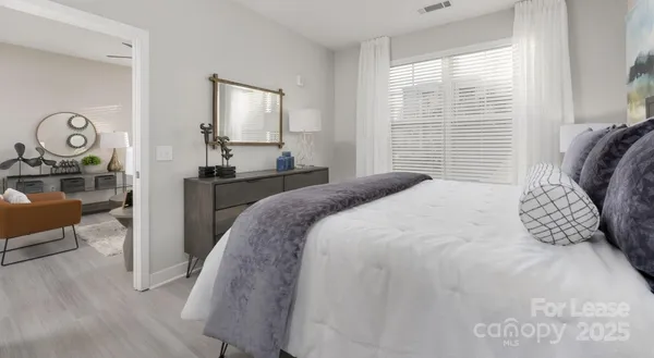 a bedroom with a bed and a table
