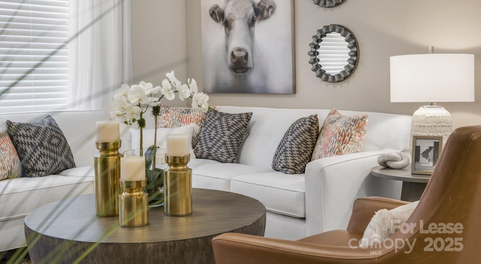 4010 Waiting Street, Unit B1 Matthews, NC 28105 - Photo 26 of 38 a living room with furniture and wooden floor