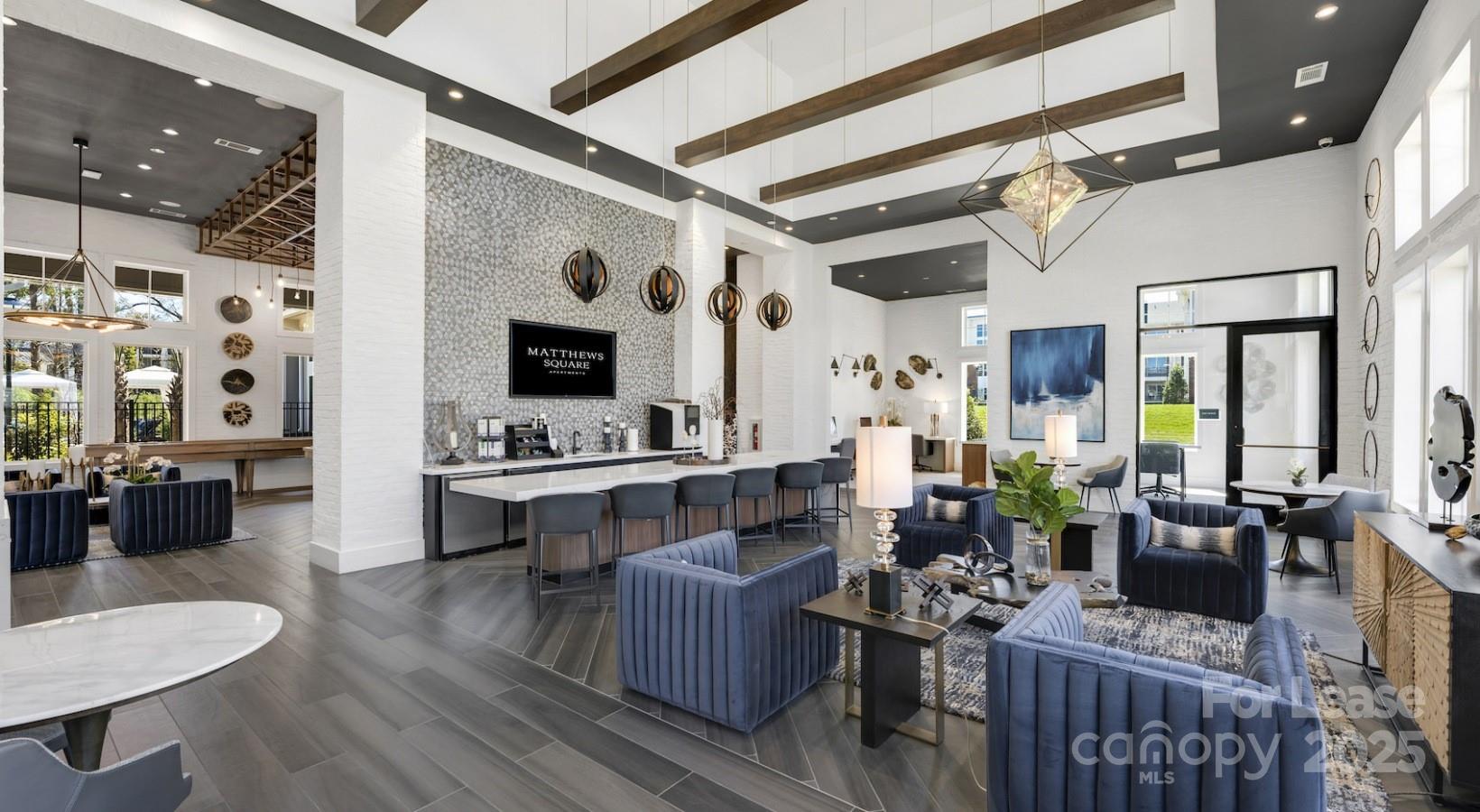 4010 Waiting Street, Unit B1 Matthews, NC 28105 - Photo 31 of 38 a living room with furniture and a fireplace
