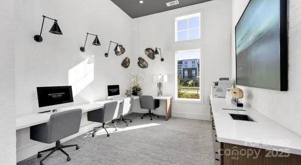 a view of a workspace with furniture