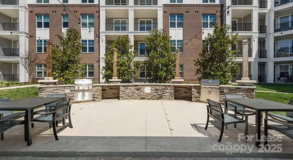 a view of a building with sitting area