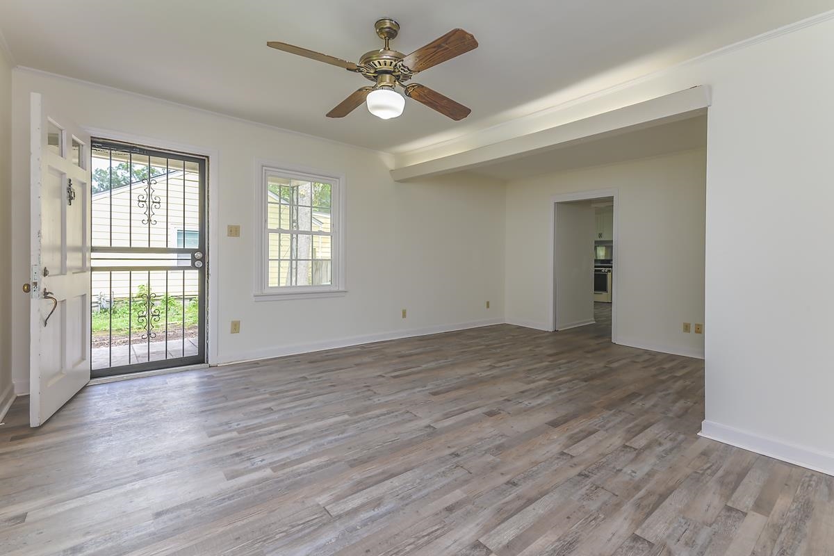 4934 Byron Road Memphis, TN 38122 - Photo 4 of 25 Unfurnished room featuring wood-type flooring and ceiling fan