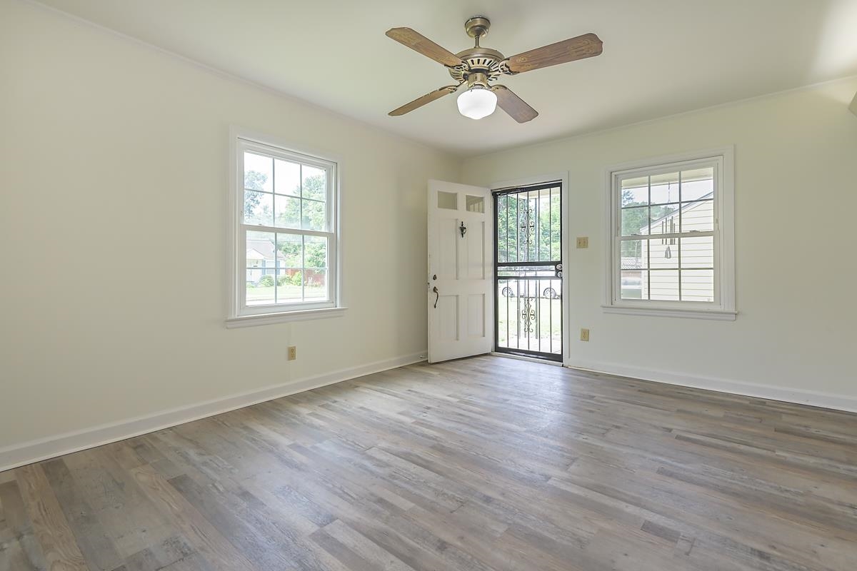 4934 Byron Road Memphis, TN 38122 - Photo 7 of 25 Spare room with hardwood / wood-style flooring and ceiling fan