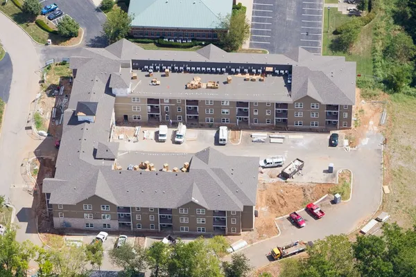 an aerial view of residential houses with outdoor space