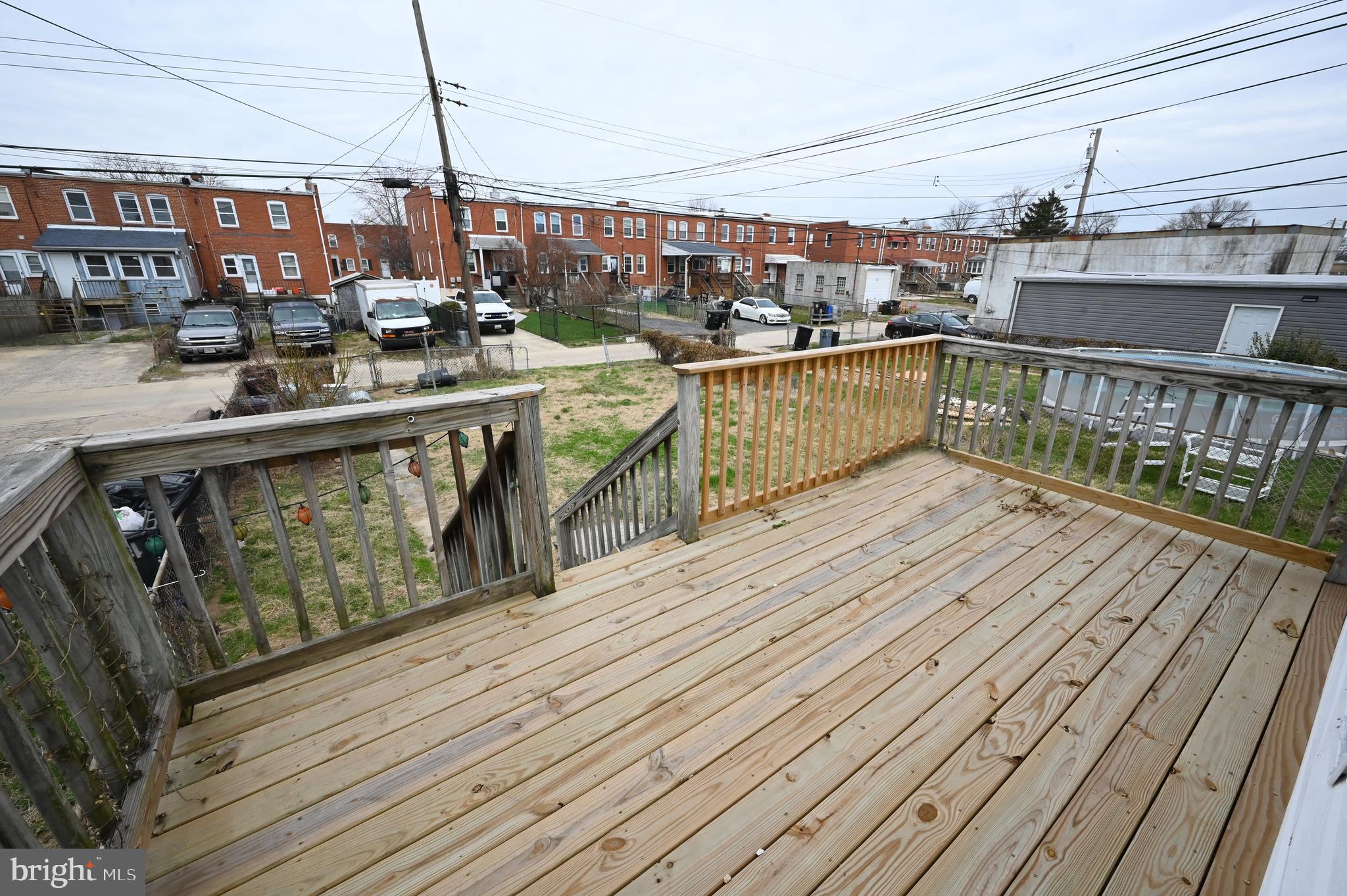 2952 Sollers Point Road, Unit B Dundalk, MD 21222 - Photo 34 of 37 a view of a balcony with wooden floor and outdoor seating
