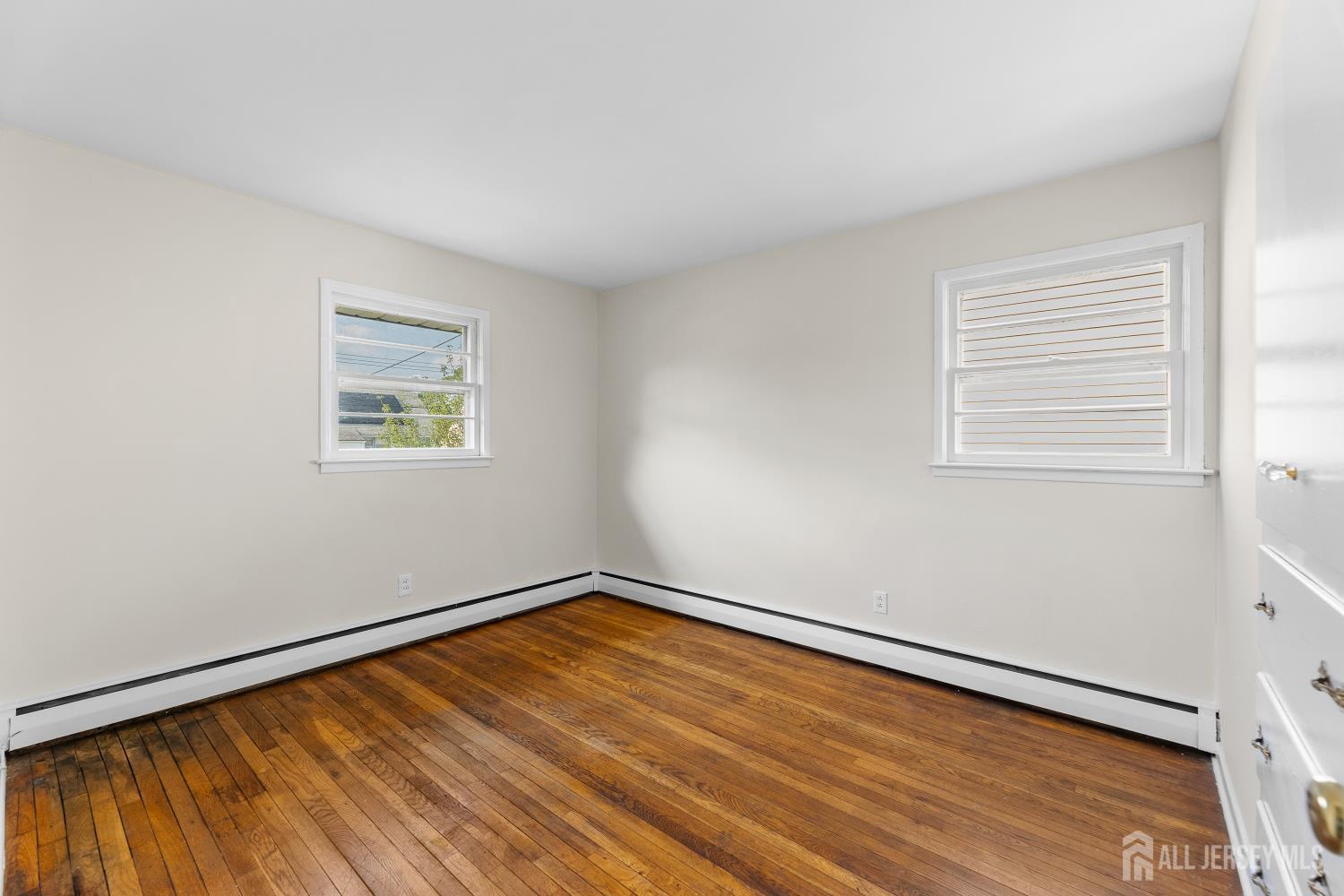 82 Mercer Street Menlo Park Terrace, NJ 08840 - Photo 16 of 31 an empty room with a window