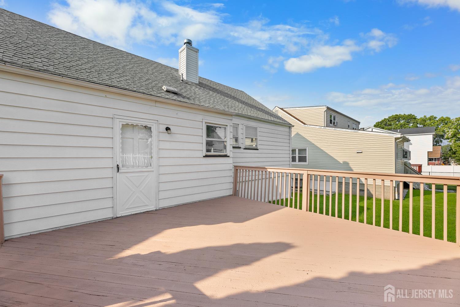 82 Mercer Street Menlo Park Terrace, NJ 08840 - Photo 20 of 31 a view of a house with a balcony