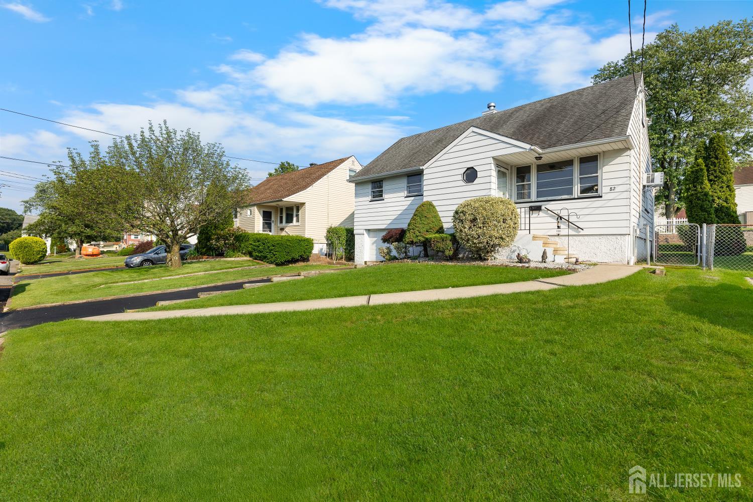 82 Mercer Street Menlo Park Terrace, NJ 08840 - Photo 2 of 31 a front view of house with yard and green space