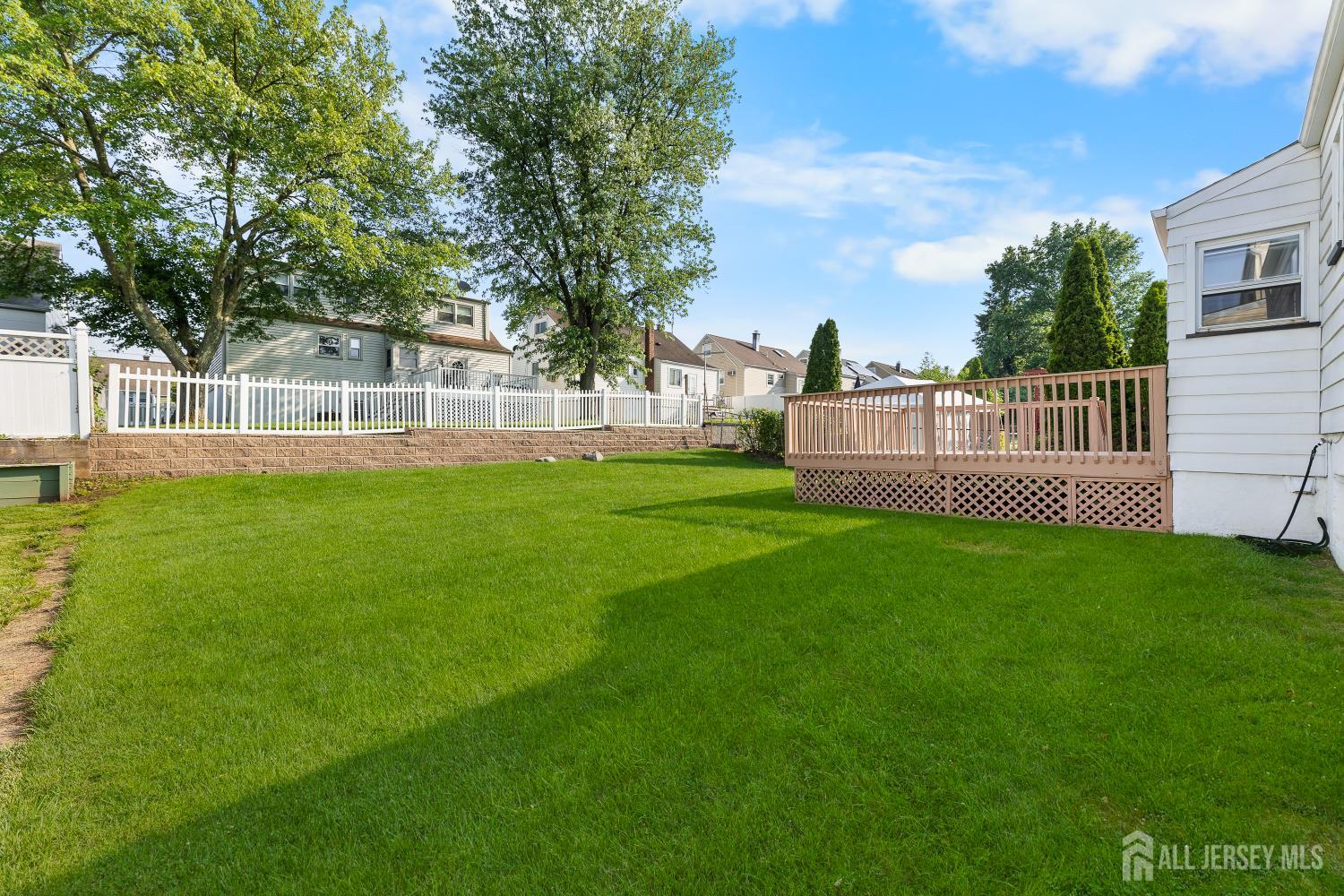 82 Mercer Street Menlo Park Terrace, NJ 08840 - Photo 25 of 31 a view of a house with a back yard