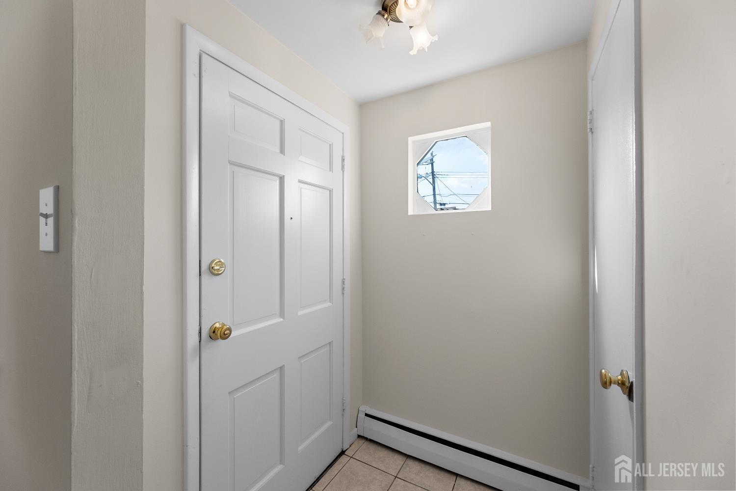 82 Mercer Street Menlo Park Terrace, NJ 08840 - Photo 5 of 31 a view of a hallway with front door