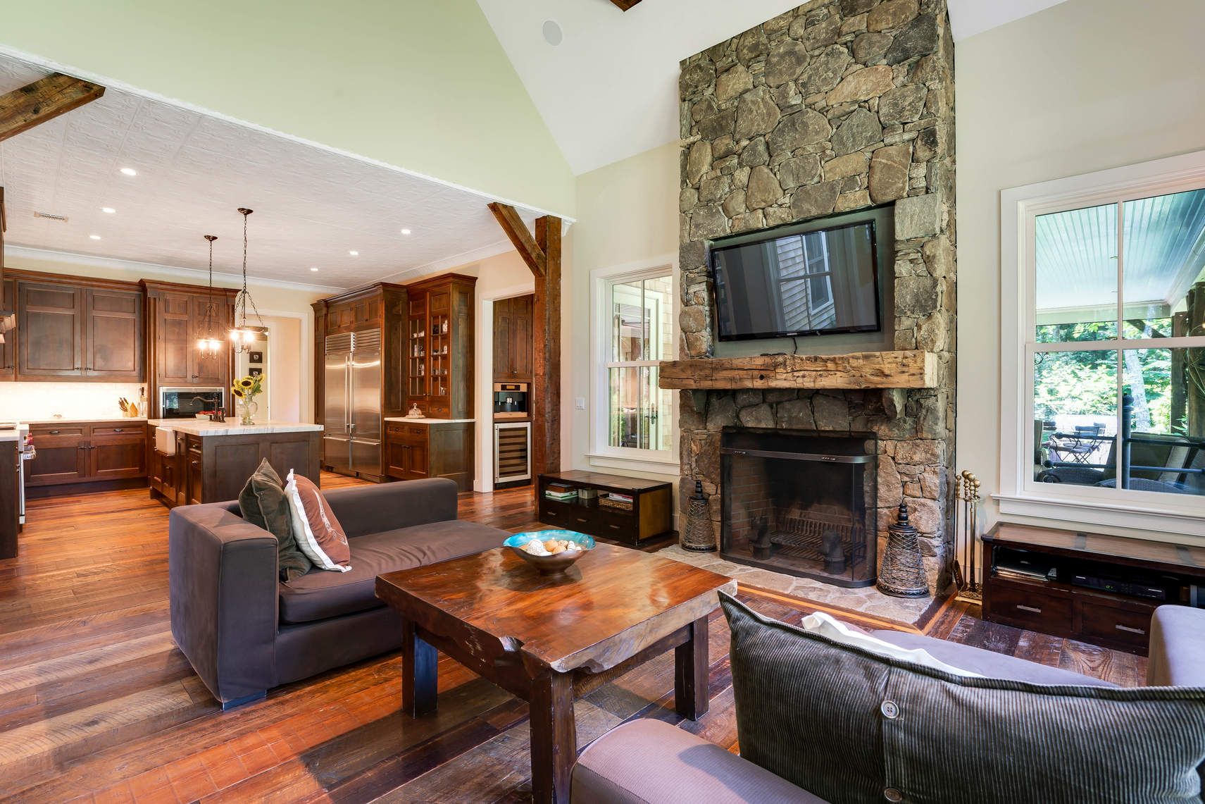 118 NW Path Sagaponack, NY 11962 - Photo 14 of 18 a living room with furniture a flat screen tv and a fireplace
